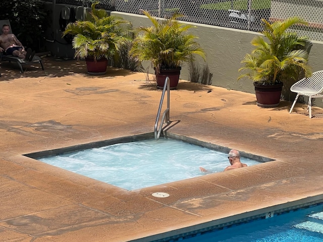 view of swimming pool with a patio area