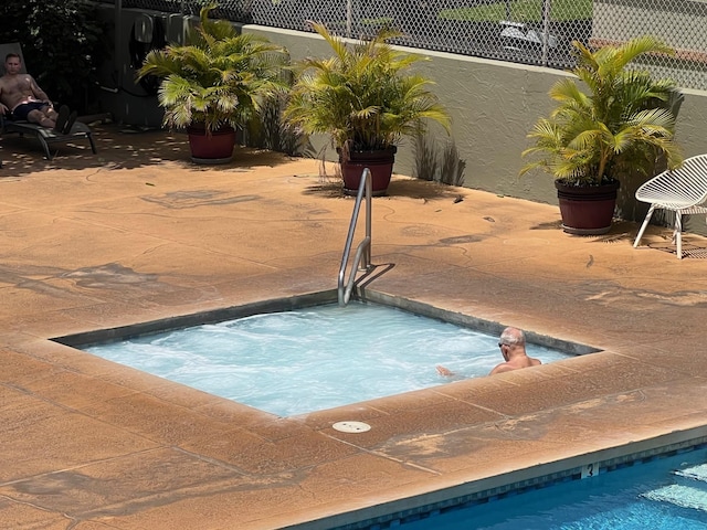 715 S Kihei Rd Unit D144, Kihei, HI 96753 - view of pool with a hot tub and a patio area