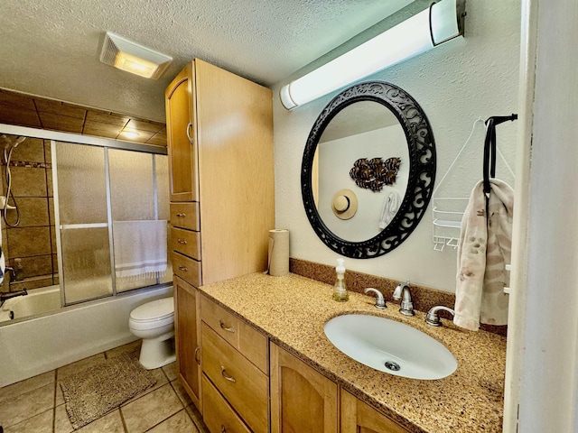 full bathroom featuring shower / bath combination with glass door, vanity, a textured ceiling, and toilet