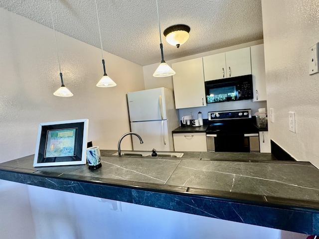 kitchen with electric range oven, sink, white refrigerator, decorative light fixtures, and white cabinets