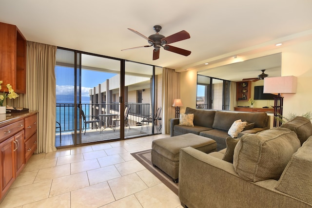 4327 Lower Honoapiilani Rd Unit 1203, Lahaina, HI 96761 - living area with a ceiling fan, expansive windows, and light tile patterned flooring