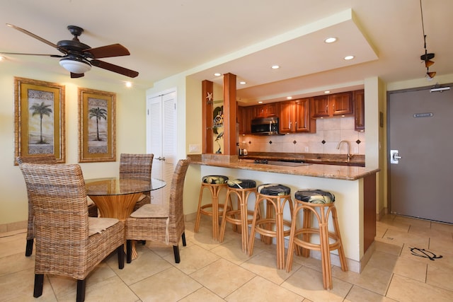 4327 Lower Honoapiilani Rd Unit 1203, Lahaina, HI 96761 - dining area featuring a ceiling fan, recessed lighting, and light tile patterned floors