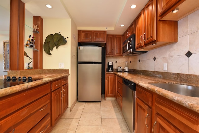 4327 Lower Honoapiilani Rd Unit 1203, Lahaina, HI 96761 - kitchen featuring stainless steel appliances, backsplash, recessed lighting, brown cabinets, and light tile patterned flooring