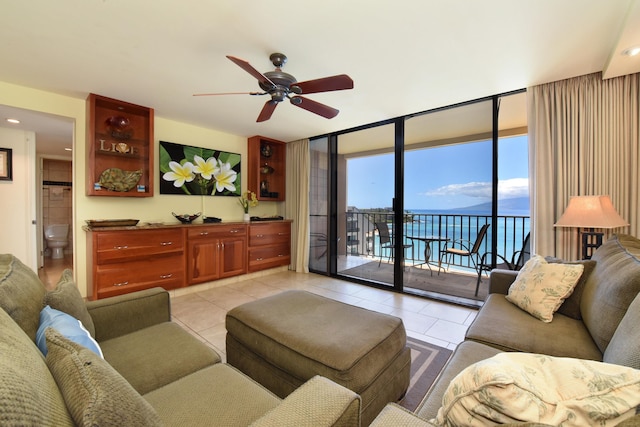 4327 Lower Honoapiilani Rd Unit 1203, Lahaina, HI 96761 - living area with ceiling fan, light tile patterned flooring, and a wall of windows