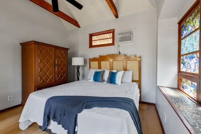 bedroom with a wall mounted air conditioner, ceiling fan, light hardwood / wood-style floors, and lofted ceiling with beams