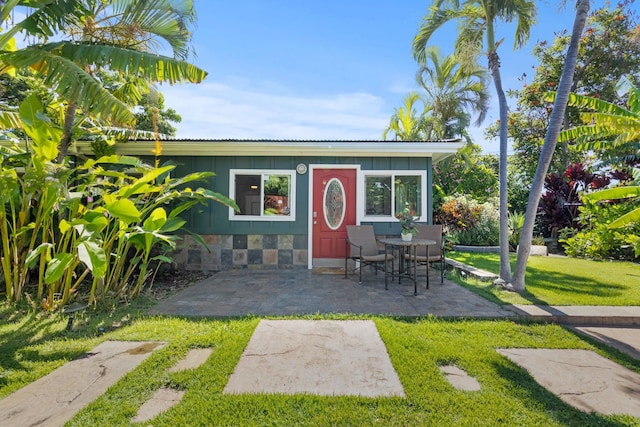 view of outdoor structure featuring a lawn