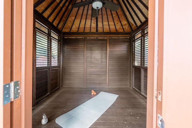 interior space featuring wooden ceiling, vaulted ceiling, ceiling fan, and a healthy amount of sunlight