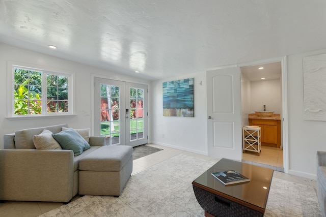 tiled living room featuring french doors