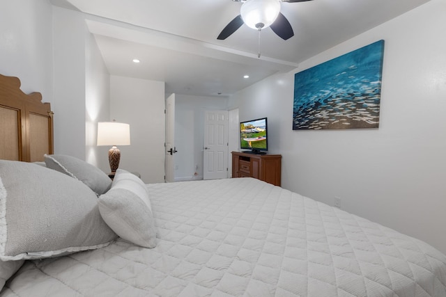 bedroom featuring ceiling fan and beam ceiling