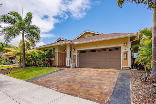 235 Kilioopu St, Wailuku, HI 96793 - ranch-style home featuring concrete driveway, a garage, and a front lawn