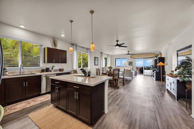 235 Kilioopu St, Wailuku, HI 96793 - kitchen with dishwasher, a sink, light countertops, wood finished floors, and healthy amount of natural light