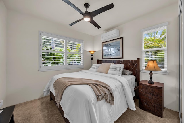 235 Kilioopu St, Wailuku, HI 96793 - carpeted bedroom with a wall mounted AC and ceiling fan
