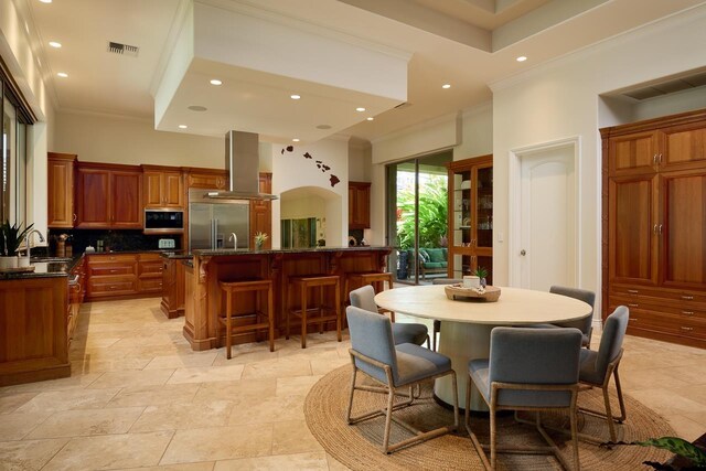 dining room featuring recessed lighting, visible vents, and ornamental molding