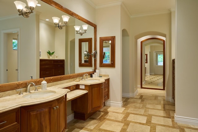 bathroom featuring a wealth of natural light, ornamental molding, tile patterned floors, and vanity