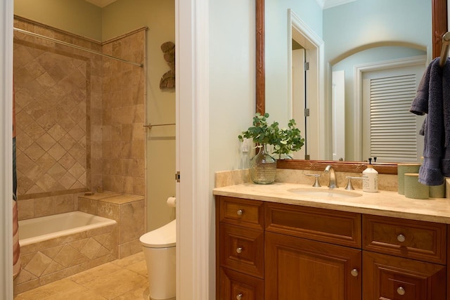 full bathroom featuring tiled shower / bath combo, tile patterned flooring, toilet, and vanity