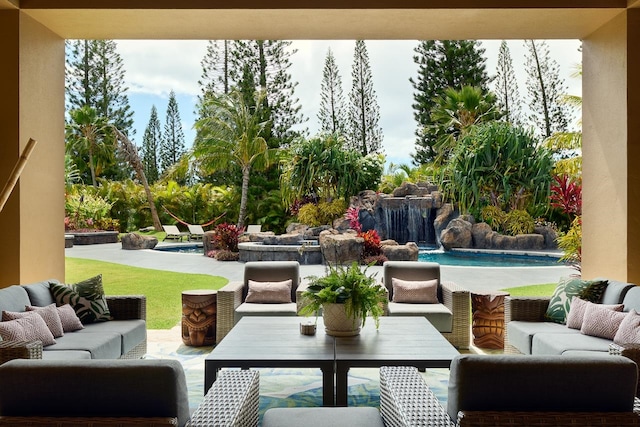 view of patio featuring an outdoor living space and pool water feature