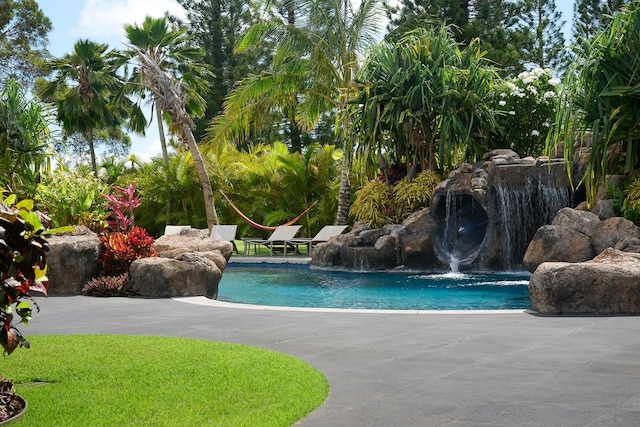 view of pool featuring pool water feature