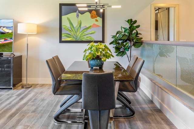 dining space featuring wood-type flooring