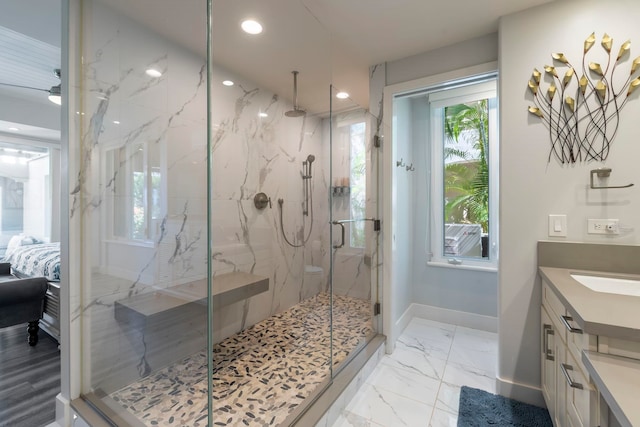 bathroom featuring walk in shower, tile floors, and vanity