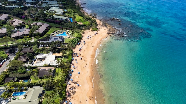 drone / aerial view featuring a water view and a beach view