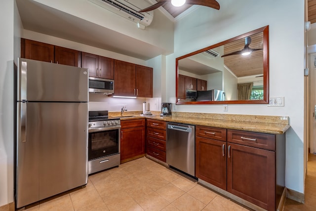 5315 Lower Honoapiilani Rd Unit D224, Lahaina, HI 96761 - kitchen with stainless steel appliances, ceiling fan, light tile patterned flooring, a wall mounted air conditioner, and light stone counters