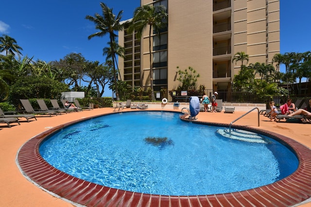 view of swimming pool with a patio