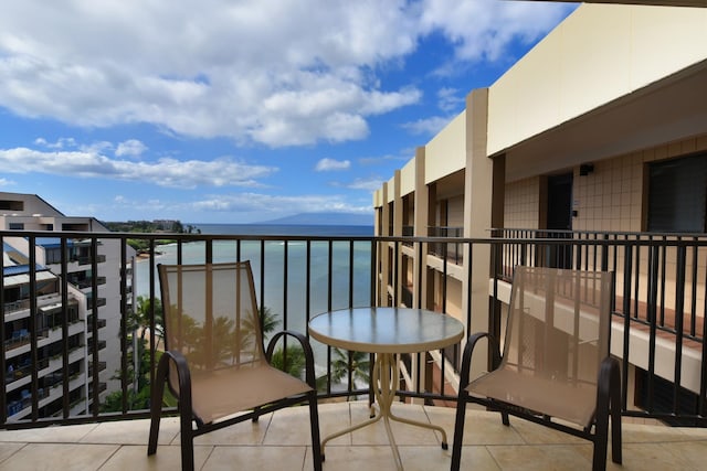 balcony featuring a water view