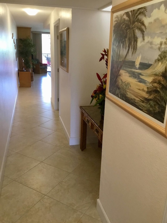 corridor with light tile patterned floors