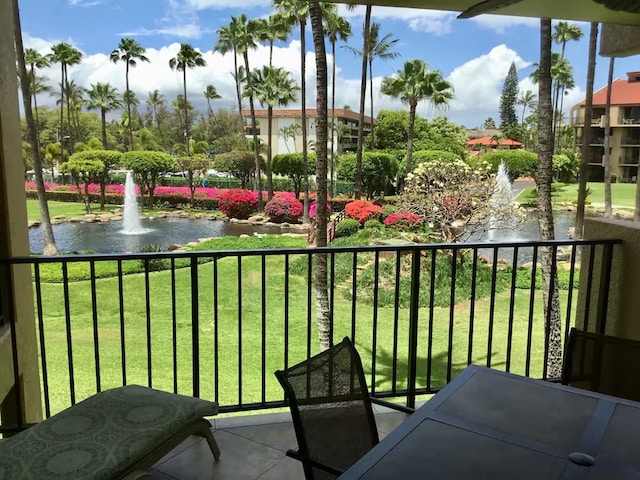 balcony featuring a water view