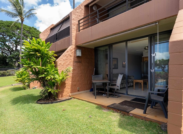 exterior space featuring a patio area and a yard