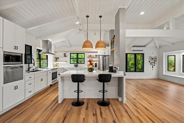 kitchen featuring open shelves, appliances with stainless steel finishes, wall chimney range hood, wood ceiling, and light countertops