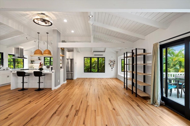 unfurnished living room with light wood-style floors, plenty of natural light, wood ceiling, baseboards, and recessed lighting