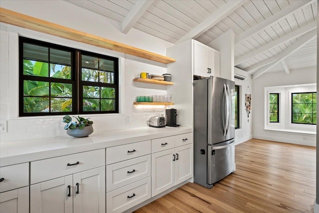kitchen with freestanding refrigerator, wood ceiling, tasteful backsplash, open shelves, and plenty of natural light