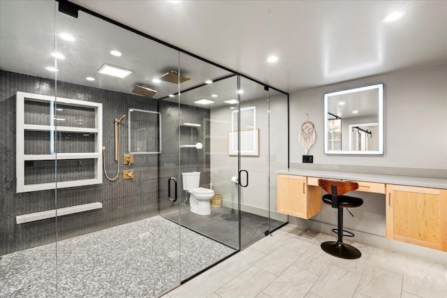full bath featuring a shower stall, toilet, recessed lighting, and vanity