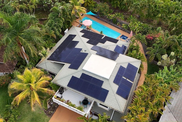 view of subject property with a pool