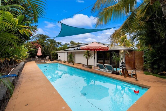 swimming pool with a patio