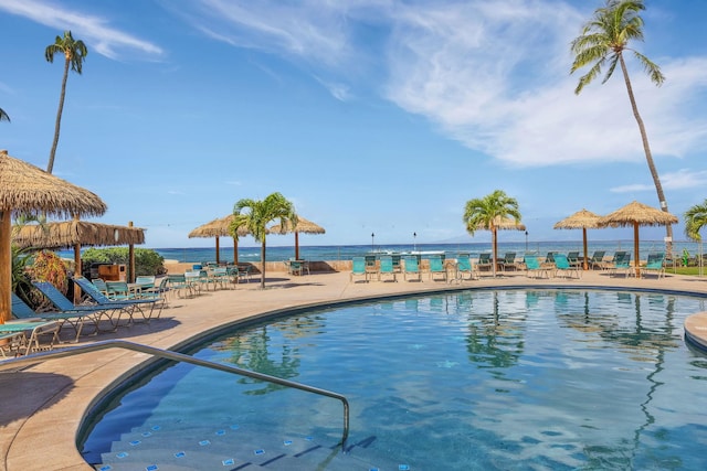 pool with a gazebo, a patio area, and fence