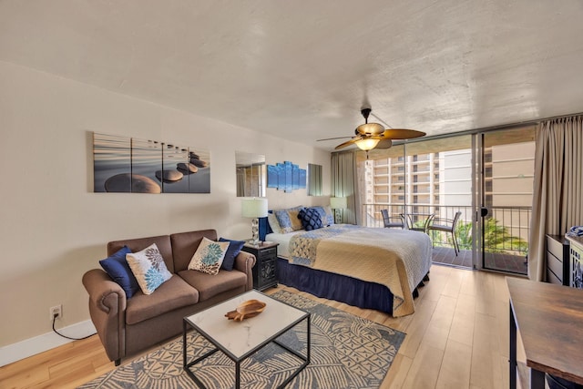 bedroom with baseboards, floor to ceiling windows, light wood-type flooring, a ceiling fan, and access to outside