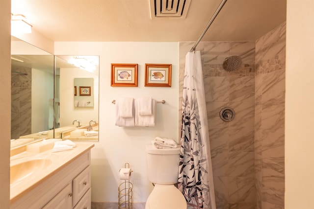 bathroom with a shower with curtain, vanity, and toilet