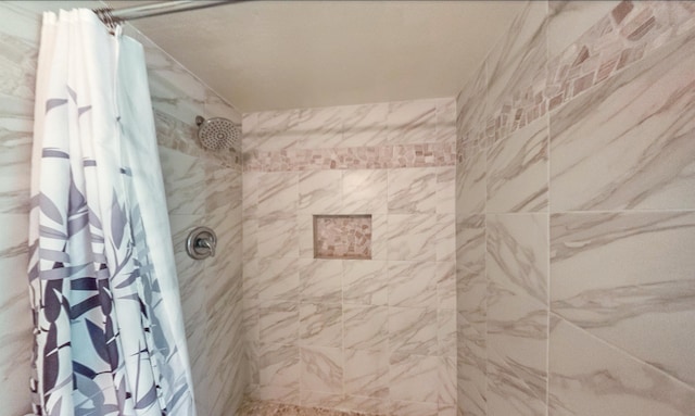 bathroom featuring a shower with curtain