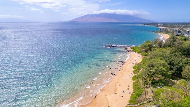 water view with a mountain view and a beach view