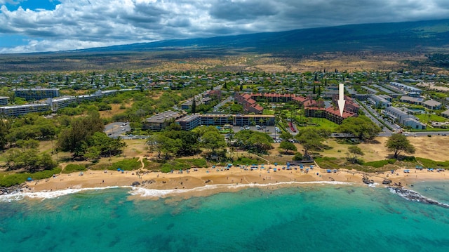 bird's eye view with a view of the beach and a water and mountain view