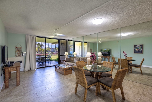 dining space featuring a textured ceiling, floor to ceiling windows, and light tile patterned flooring