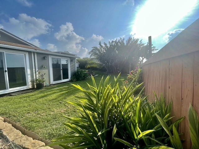 view of yard with a fenced backyard