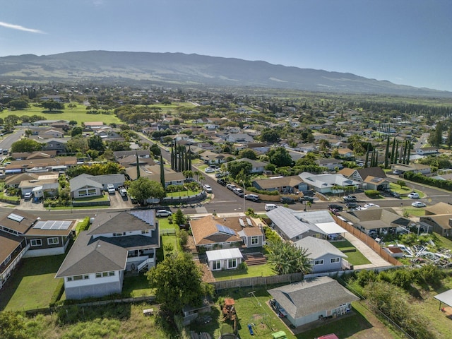 drone / aerial view featuring a residential view and a mountain view