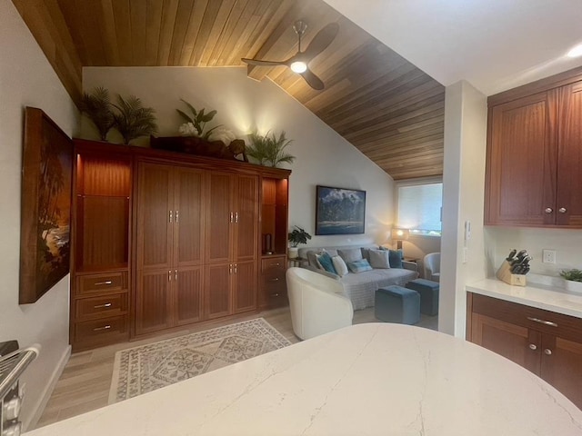 interior space featuring light wood-type flooring, lofted ceiling, wooden ceiling, and ceiling fan