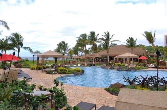 view of swimming pool featuring a gazebo and a patio area