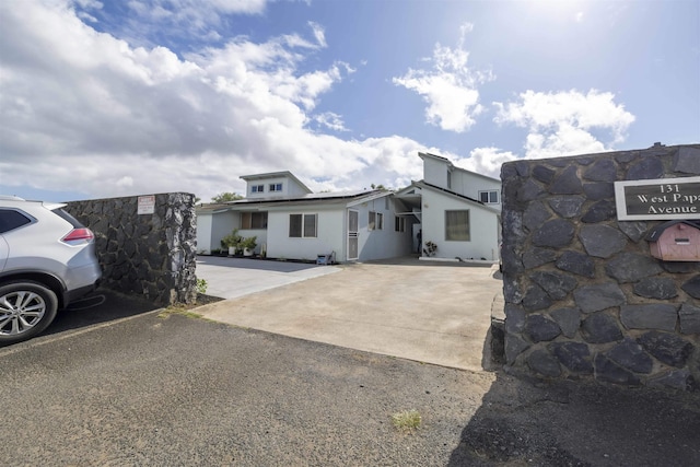 view of front of property with concrete driveway