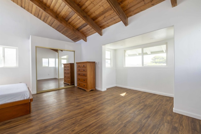 unfurnished bedroom featuring wood ceiling, dark hardwood / wood-style floors, a closet, and vaulted ceiling with beams