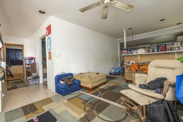 tiled living room with ceiling fan